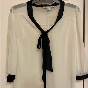 White top with black tie